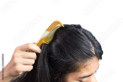 women head with dandruff Caused by the problem of dirty. Or caused by skin disease or Seborrheic Dermatitis. It has white scaly and it will cause itch. isolated on white background and clipping path. photo