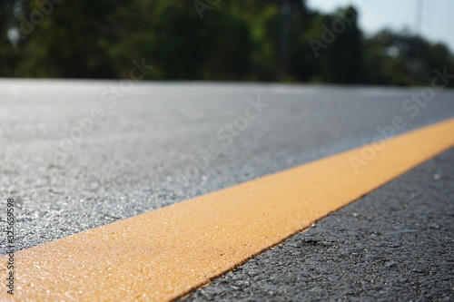 Yellow traffic on the road surface in Thailand