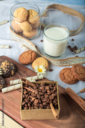 Coffee beans and butter cookies with a glass of milk
