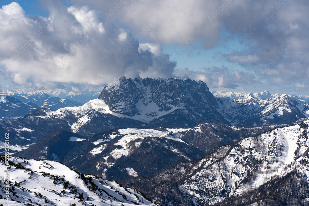 beautiful panoramic view over the Austrian Alps to the Wilder Kaiser mountain, blue sky with some clouds