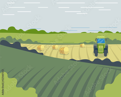 The tractor drives on the field during harvest time