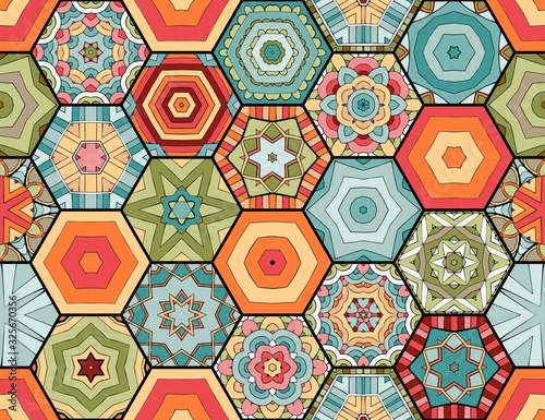 Colorful seamless patchwork pattern. Quilt blanket. Bright hexagonal tiles with abstract ornament.