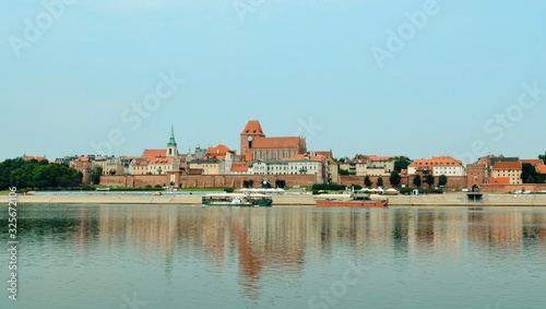 Panoramic view of old town in Torun on Vistula bank, Poland. Historical district of Torun old town by the Vistula river