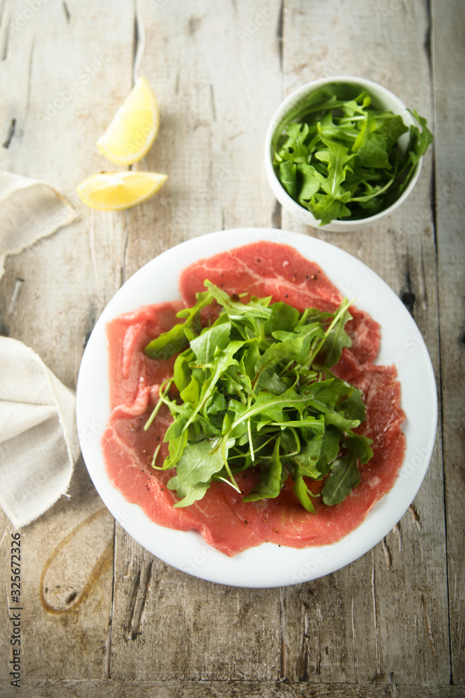 Beef carpaccio with fresh arugula salad Beef carpaccio with fresh arugula salad