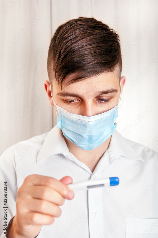 Young Man with a Thermometer Young Man with a Thermometer