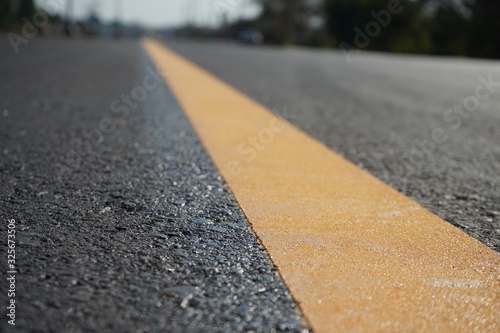 Yellow traffic on the road surface in Thailand