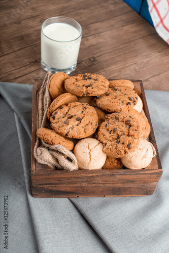 Mixed cookies with a glass of milk