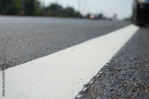 White traffic lane dividing line in Thailand