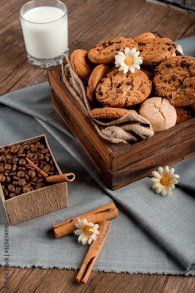 Sweet cookie box and a glass of milk Sweet cookie box and a glass of milk