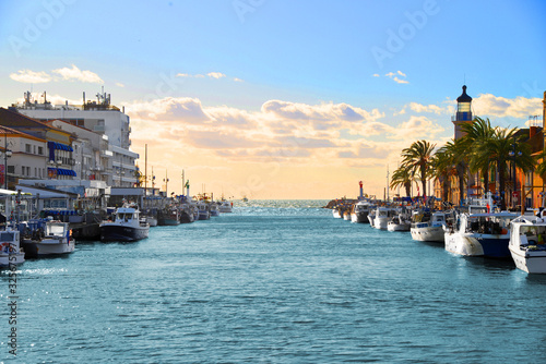 Lighthouse and old fishing port of Grau du roi in Camargue zoological nature reserve. South of France. photo