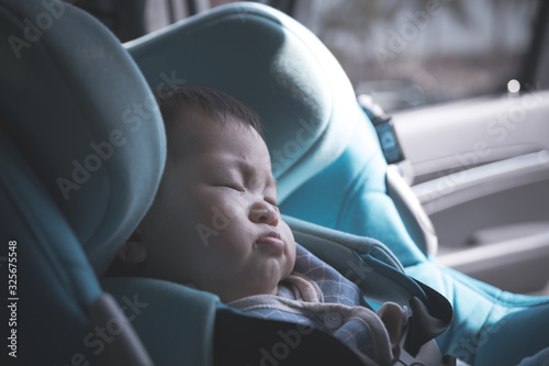 Asian little baby boy sleeping in car seat © yooranpark