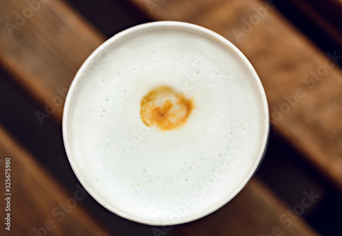 coffee foam in a disposable cup