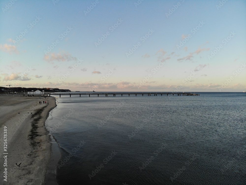 Obraz premium Aerial view of famous Ahlbeck Sea bridge, pier at baltic sea, Germany at sunset in winter