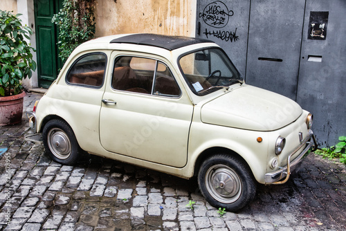 Old Fashion car fiat 500 on the street in Rome city center. photo