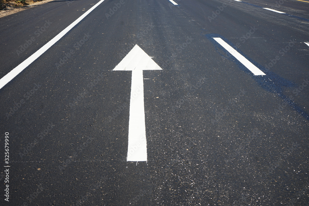 Arrows on asphalt roads and traffic lines in Thailand Arrows on asphalt roads and traffic lines in Thailand