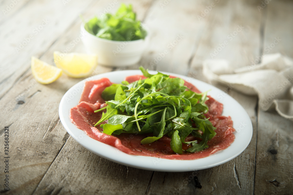 Beef carpaccio with fresh arugula salad Beef carpaccio with fresh arugula salad