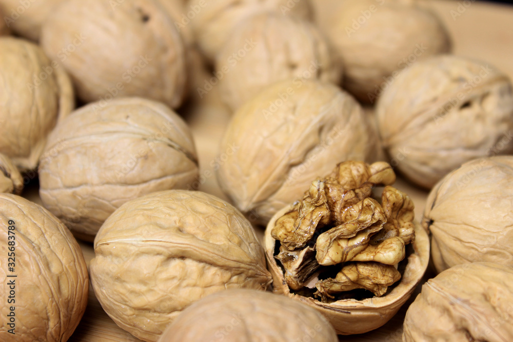 walnuts on wooden background walnuts on wooden background