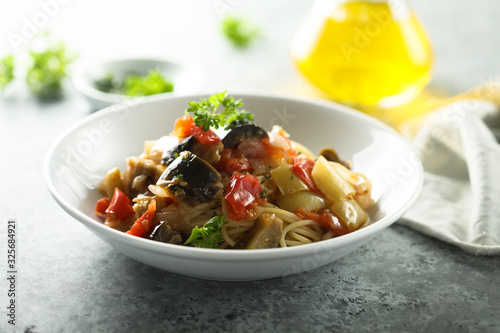 Spaghetti with vegetable ragout and fresh parsley