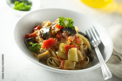 Spaghetti with vegetable ragout and fresh parsley