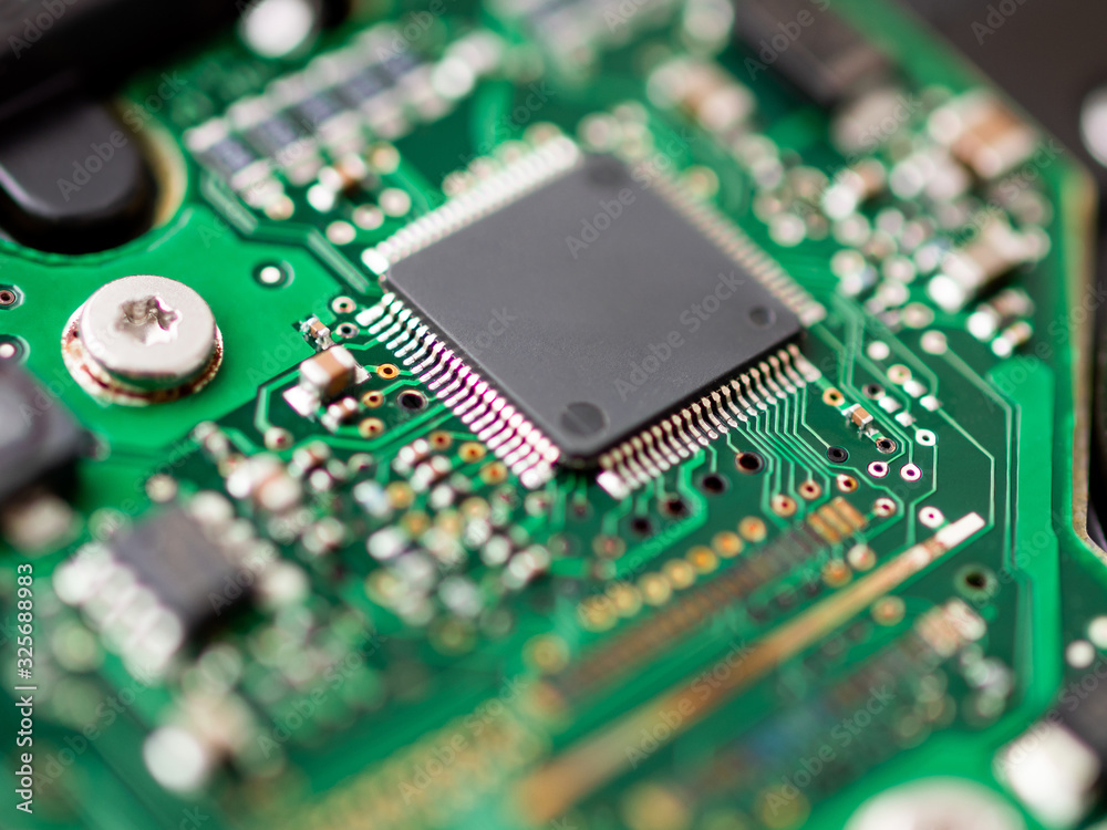 Macro photo of hard disk controller board. IT detail in computer. Macro photo of hard disk controller board. IT detail in computer.
