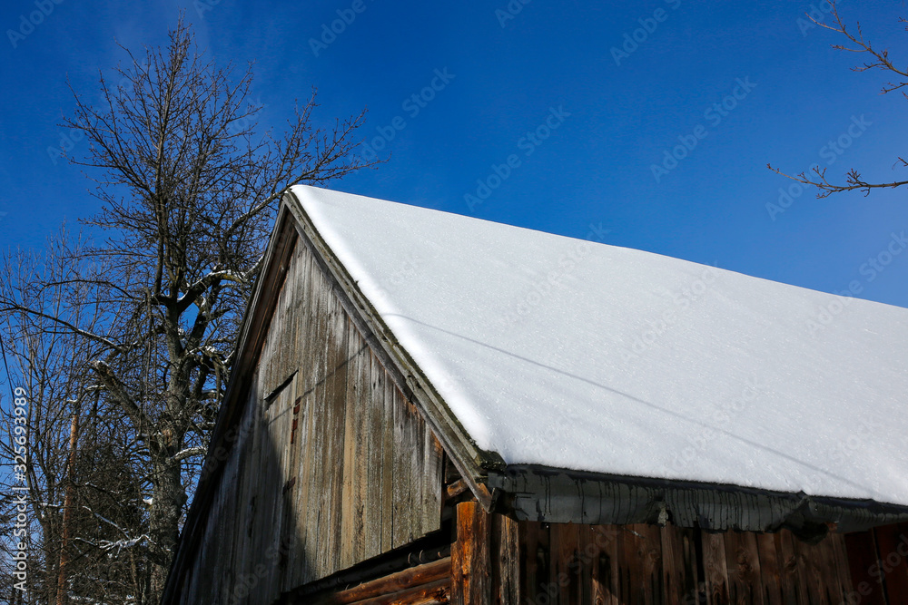 barn roof covered with snow