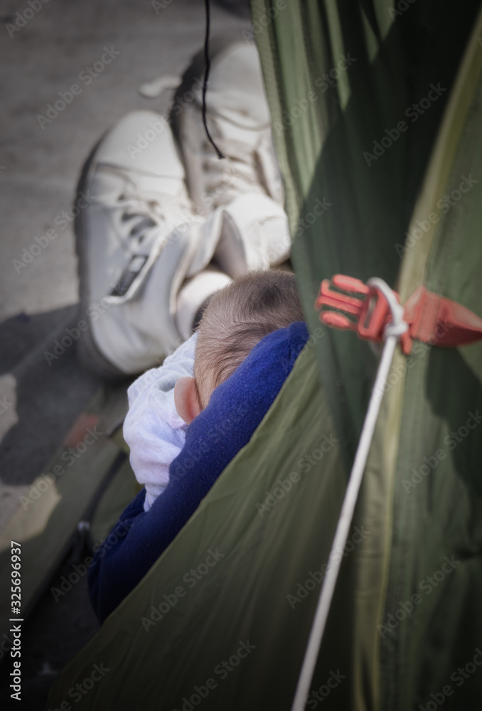 Greece, Idomeni (border with Macedonia), March 22nd 2016: the biggest refugee camp in Europe at that time, hosting up to 11.000 people mostly from Syria, Afghanistan and Iraq. Greece, Idomeni (border with Macedonia), March 22nd 2016: the biggest refugee camp in Europe at that time, hosting up to 11.000 people mostly from Syria, Afghanistan and Iraq.