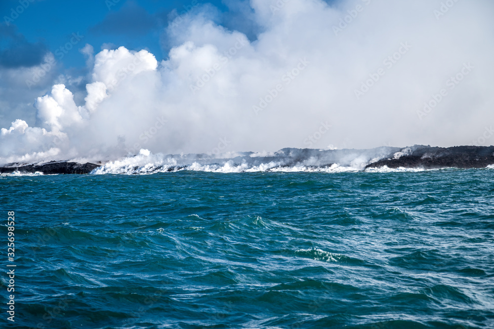 Fototapeta premium lava coast steam rising to the sky