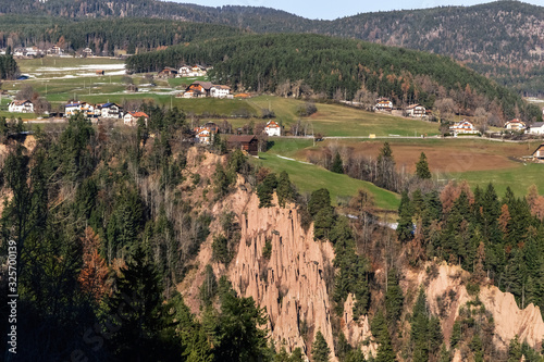 Beautiful landscape overlooking the Earth Pyramids, mountains and a valley with villages in South Tyrol.