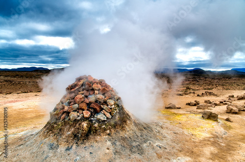 Hverir Boiling mudpots geothermal area and cracked ground around. Myvatn region, Northern part of Iceland, Europe photo
