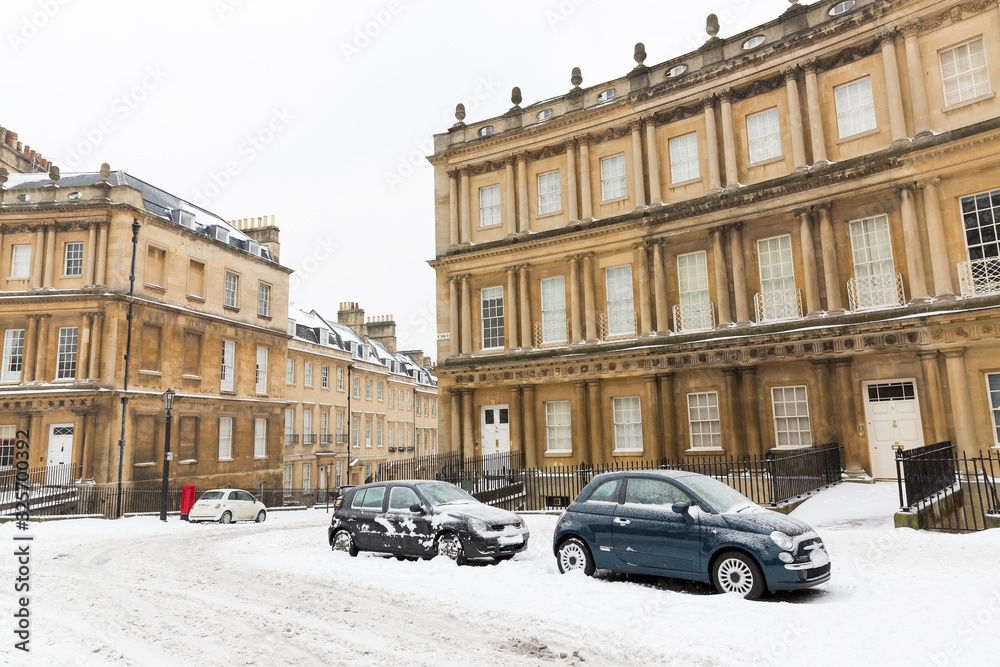 Snowy conditions at the Circus, a Georgian terraced Street in Bath, England.