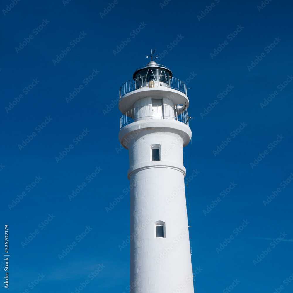 The lighthouse and beach in Torrox on the Costa Del Sol Spaon The lighthouse and beach in Torrox on the Costa Del Sol Spaon