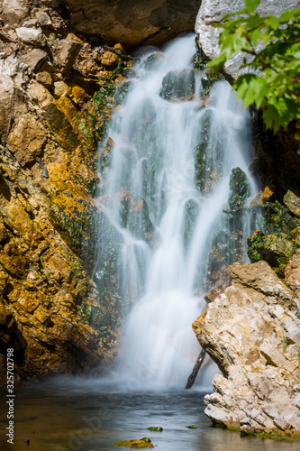 small waterfall on mountain river