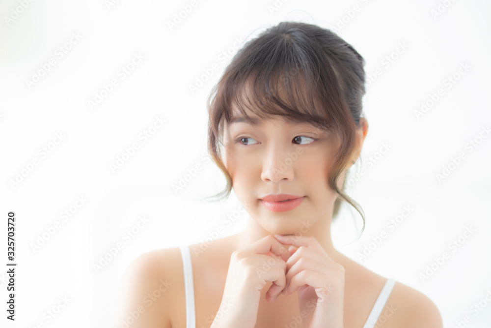 Portrait of beautiful young asian woman smile while wake up healthy and wellness with sunrise at morning in the bedroom, asia girl skin care with happy with fresh, lifestyle and relax concept. Portrait of beautiful young asian woman smile while wake up healthy and wellness with sunrise at morning in the bedroom, asia girl skin care with happy with fresh, lifestyle and relax concept.