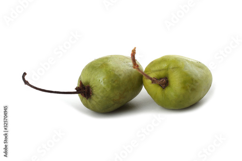 Little kiwi isolated on white. Actinidia kolomikta