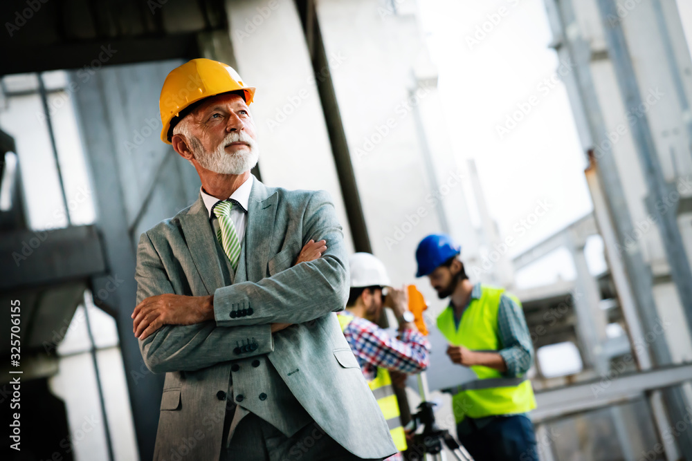Picture of construction engineer working on building site Picture of construction engineer working on building site