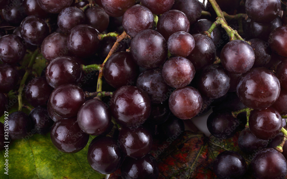 Grape on autumn leaves background Grape on autumn leaves background