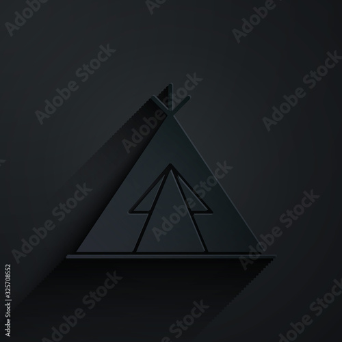Paper cut Traditional indian teepee or wigwam icon isolated on black background. Indian tent. Paper art style. Vector Illustration