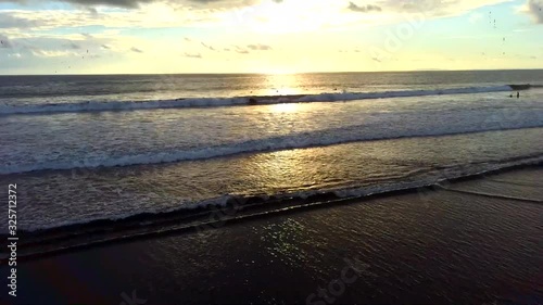 surfer Costa rica at sunset in jaco photo