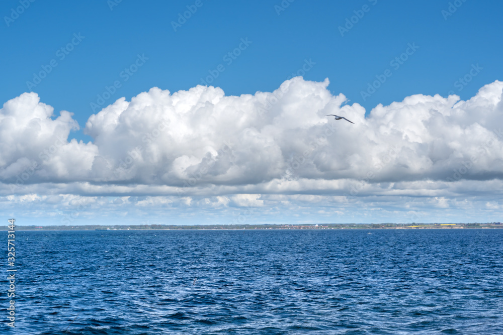 Blue sky with clouds over Oresund, Sweden