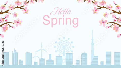 Cherry blossom twigs and silhouette of cityscape - included words "Hello spring"