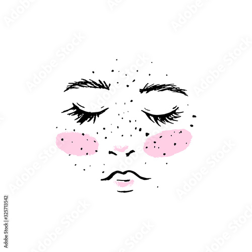 Female face with pink cheeks and freckles.