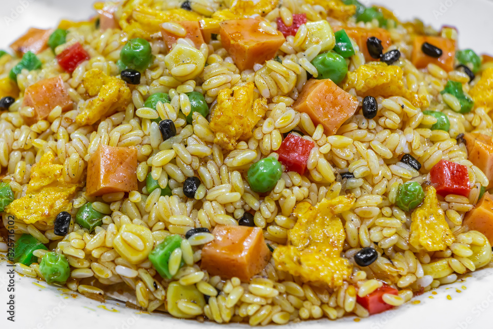 Food flat lay of traditional Chinese Fried Rice with vegetable and spices is on a big white plate Food flat lay of traditional Chinese Fried Rice with vegetable and spices is on a big white plate