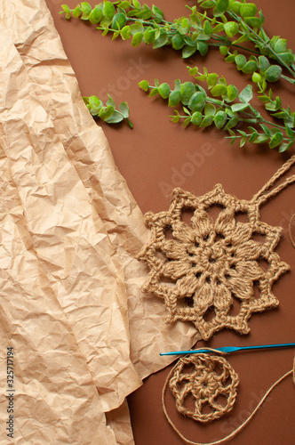 Kraft paper, jute washcloth, knitting. Concept zero waste. vertical photo, DYI