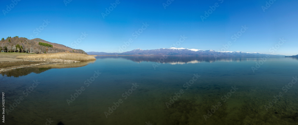 Blue Lake with mountain reflection - Prespa Lake, Macedonia - Panoramic photo