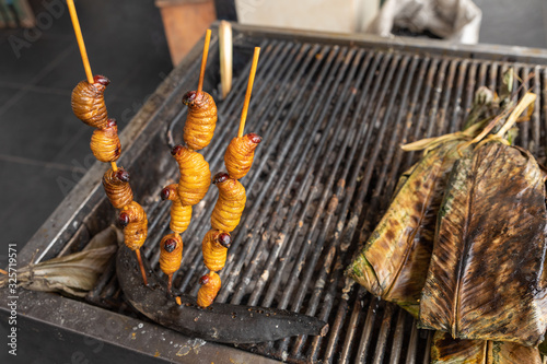 Edible palm weevil larvae (Rhynchophorus phoenicis) at traditional food market in Puerto Francisco de Orellana. Ecuador. Amazon. photo