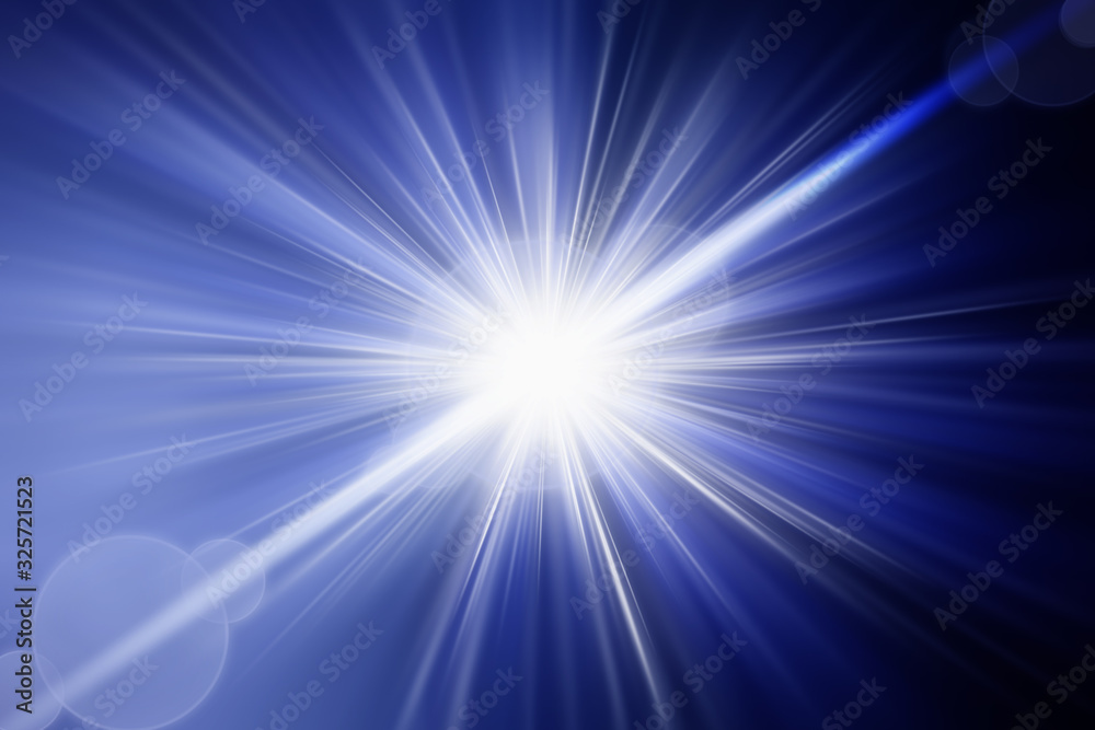 Flash light lens flares sun beams effect over dark blue