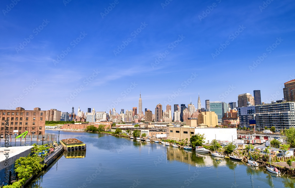 East River and Manhattan skyline on a beautiful summer day, New York City