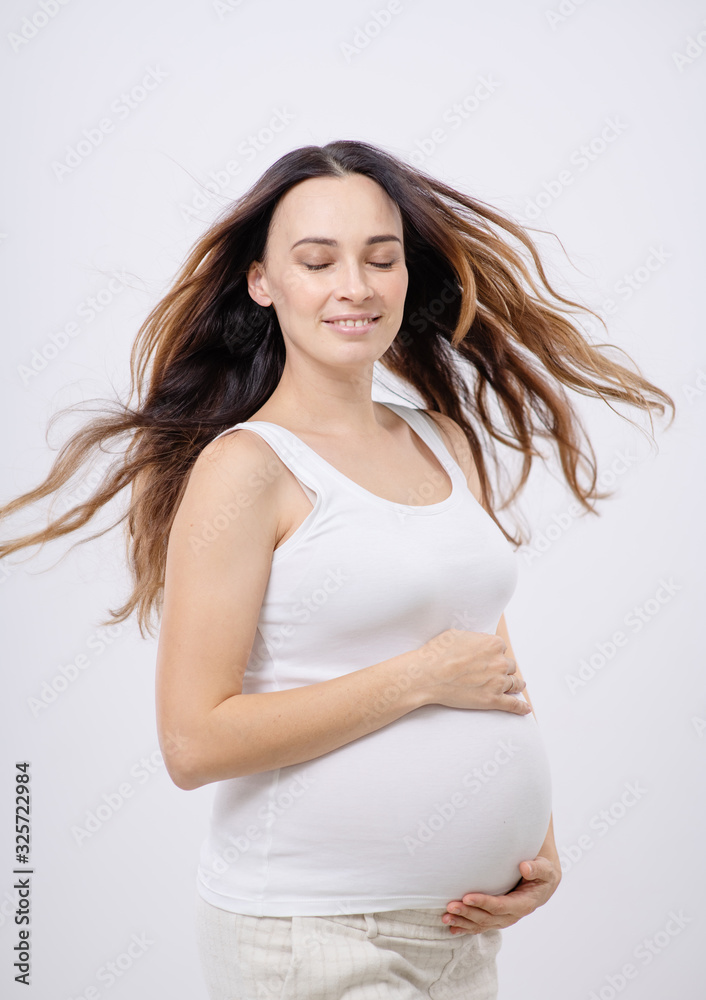 Pregnant happy Woman touching her belly. Pregnant happy Woman touching her belly.