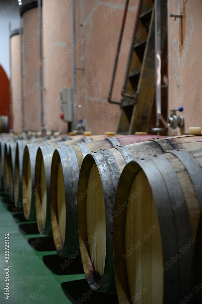 Traditional winery bodega on south of La Palma island with steel or concrete casks and wooden barrels in wine cellars, wine production on Canary Islands, Spain