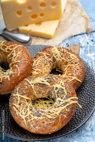 Tasty baked bagels with melted french emmental cheese